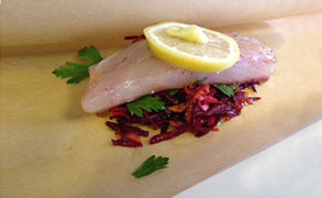 Stripped Bass- Cooked in Parchment Paper on a Bed of Shredded Beets and Carrots - a present from our fishing neighbor John 